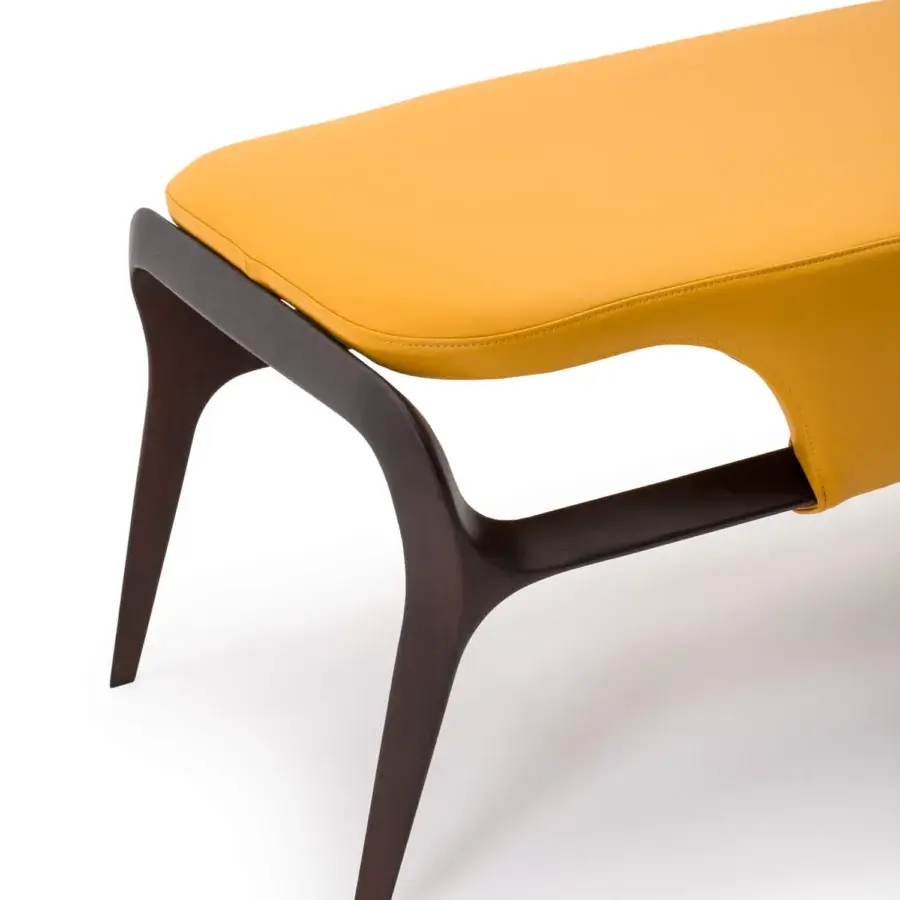 Superior Turri Vine bench with sinuous dark stained wood and fully covered vibrant yellow fabric construction