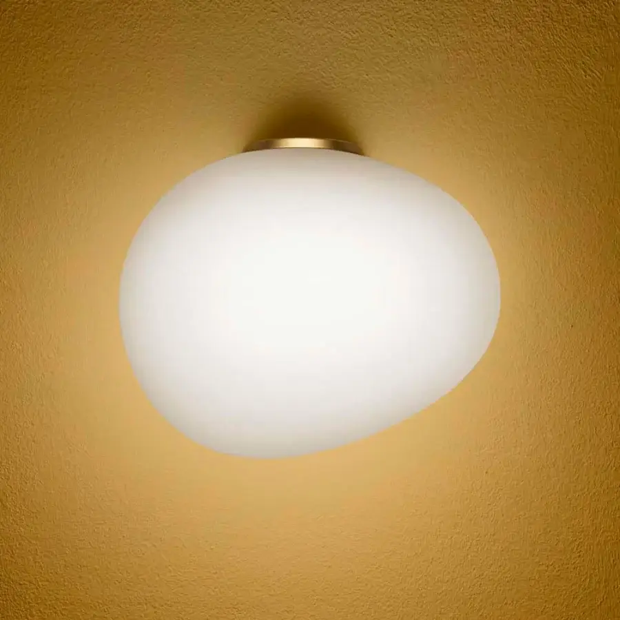 Elegant Foscarini Gregg Semi wall lamp crafted in frosted hand-blown glass with a pure white finish for relaxing ambient lighting