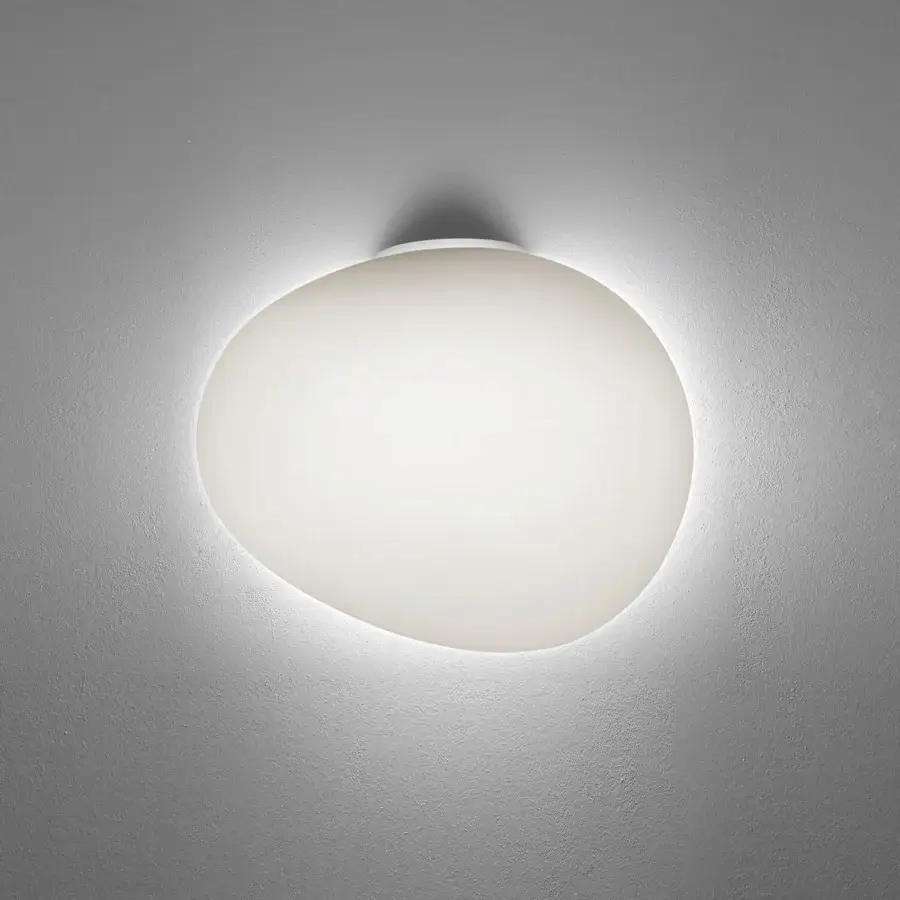 Exceptional Foscarini Gregg Semi wall lamp in frosted hand-blown glass with an asymmetrical design for ambient lighting