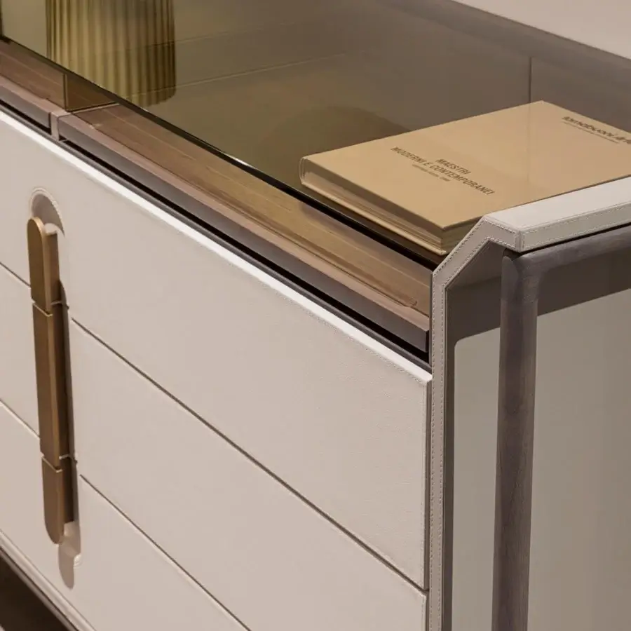 Lavish Turri Vine dresser with wooden structure, light beige leather plus bronzed glass, crafted with brushed gold metal handles