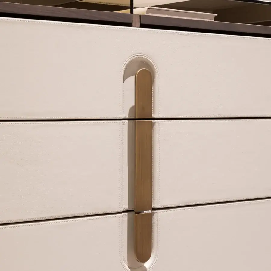 Distinguished Turri Vine dresser with wooden structure encased in light cream leather plus brushed gold metal detailing and bronzed glass