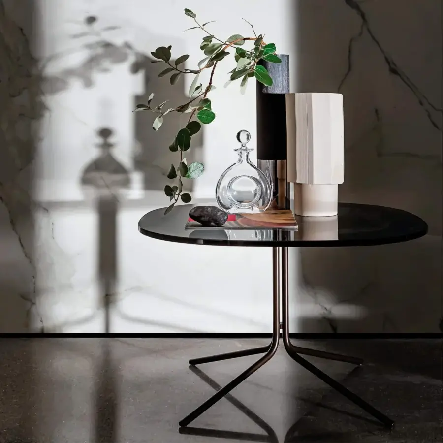 Distinguished Sovet Italia Genius coffee table with a dark glossy top and sleek burnished metal base