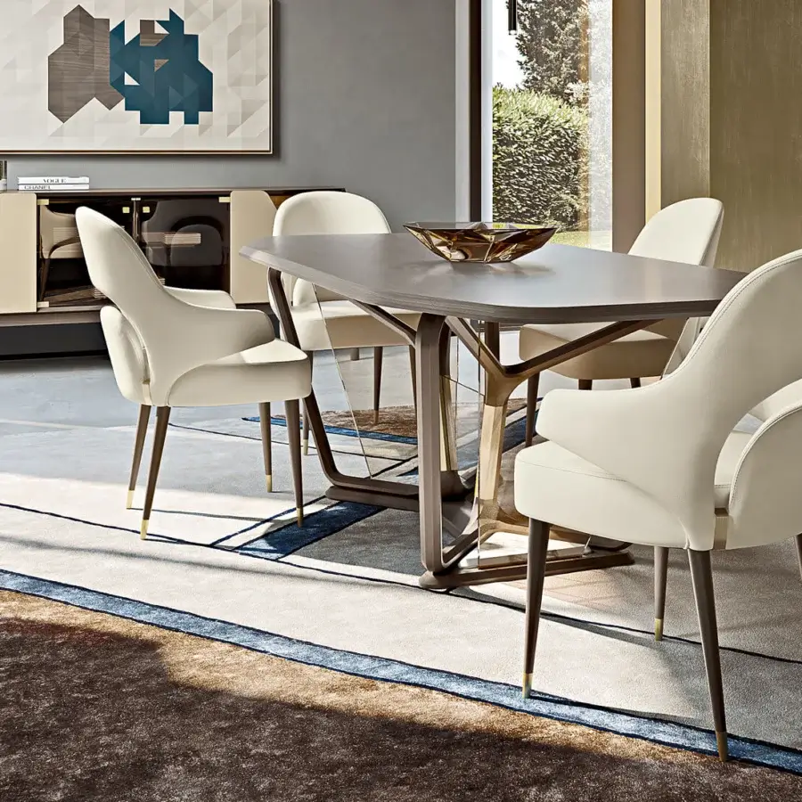 Superior Turri Vine armchair exhibits significant arched opening with creamy white plush upholstery and brushed gold natural wood legs