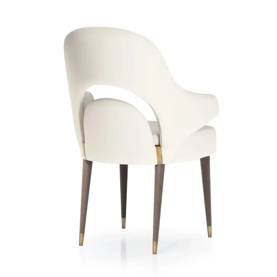 Superior Turri Vine armchair with significant arched opening and wings crafted in smooth white material with brushed gold metal details