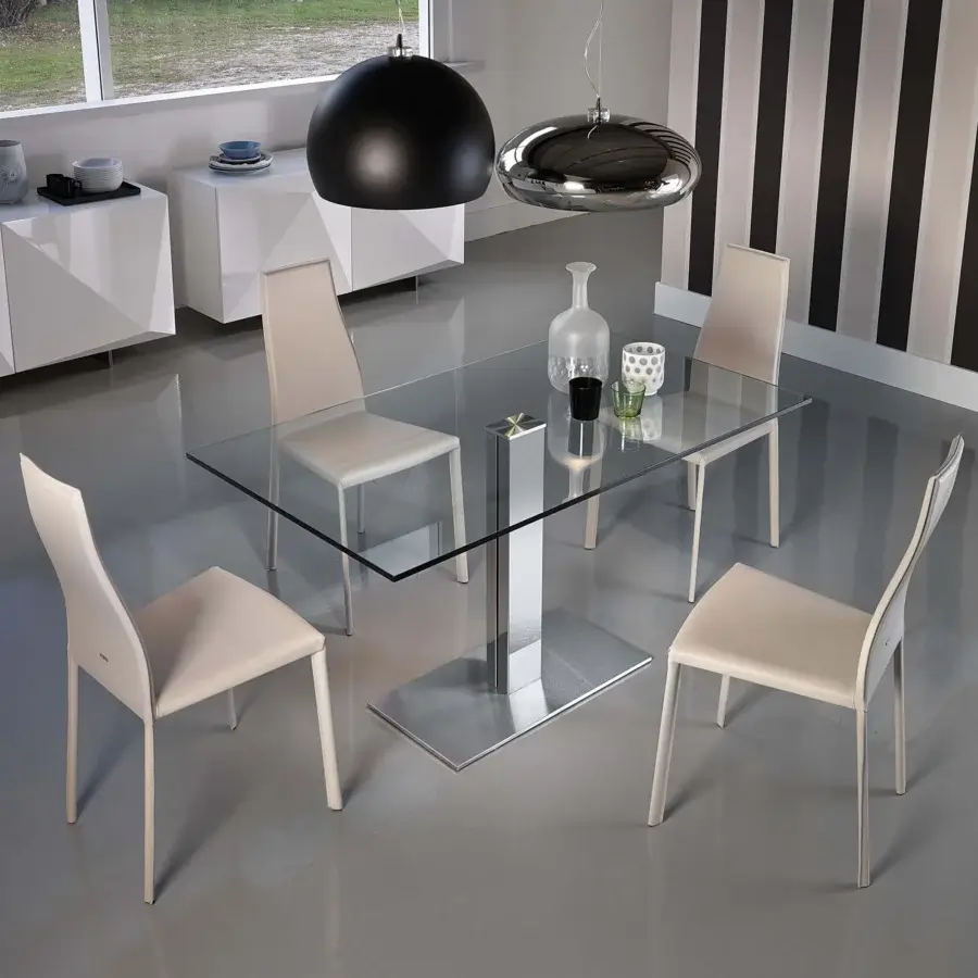 Distinguished Cattelan Italia Elvis table with a clear glass top and glossy steel base, complemented by light beige upholstered chairs
