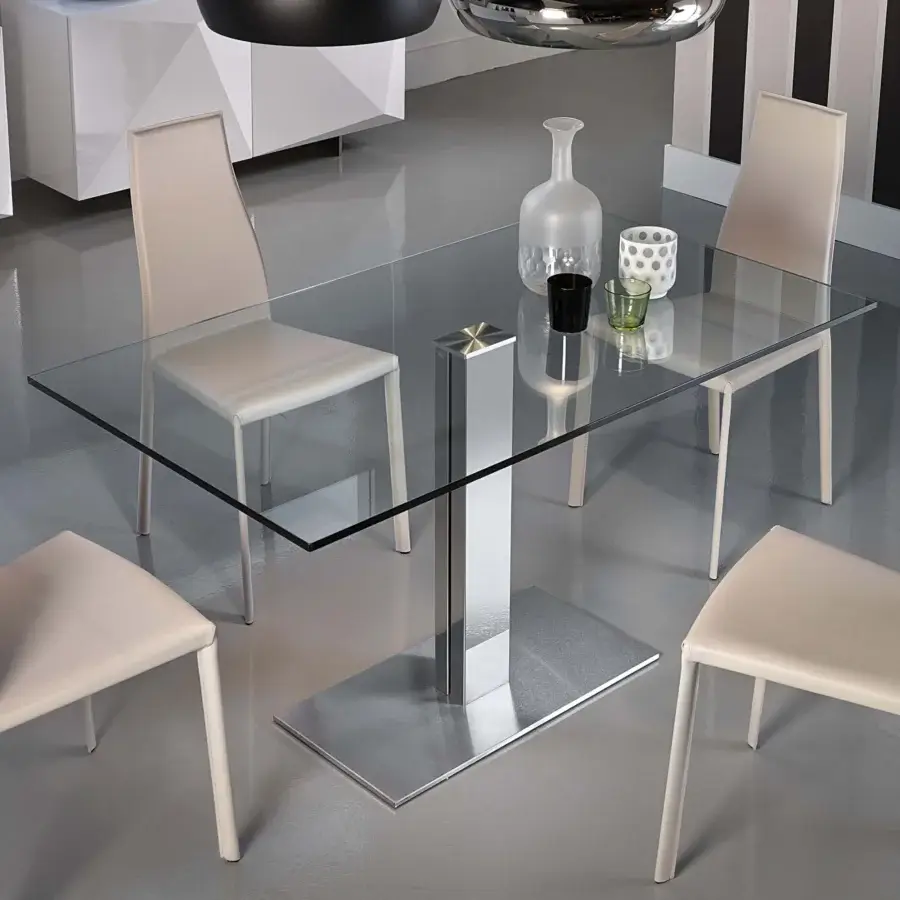 Superior Cattelan Italia Elvis table with transparent glass top and glossy steel pedestal base paired with light beige synthetic leather chairs