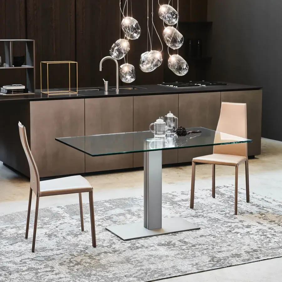 Exclusive Cattelan Italia Elvis table with sleek glass top and matte silver-gray steel base presenting a contemporary style