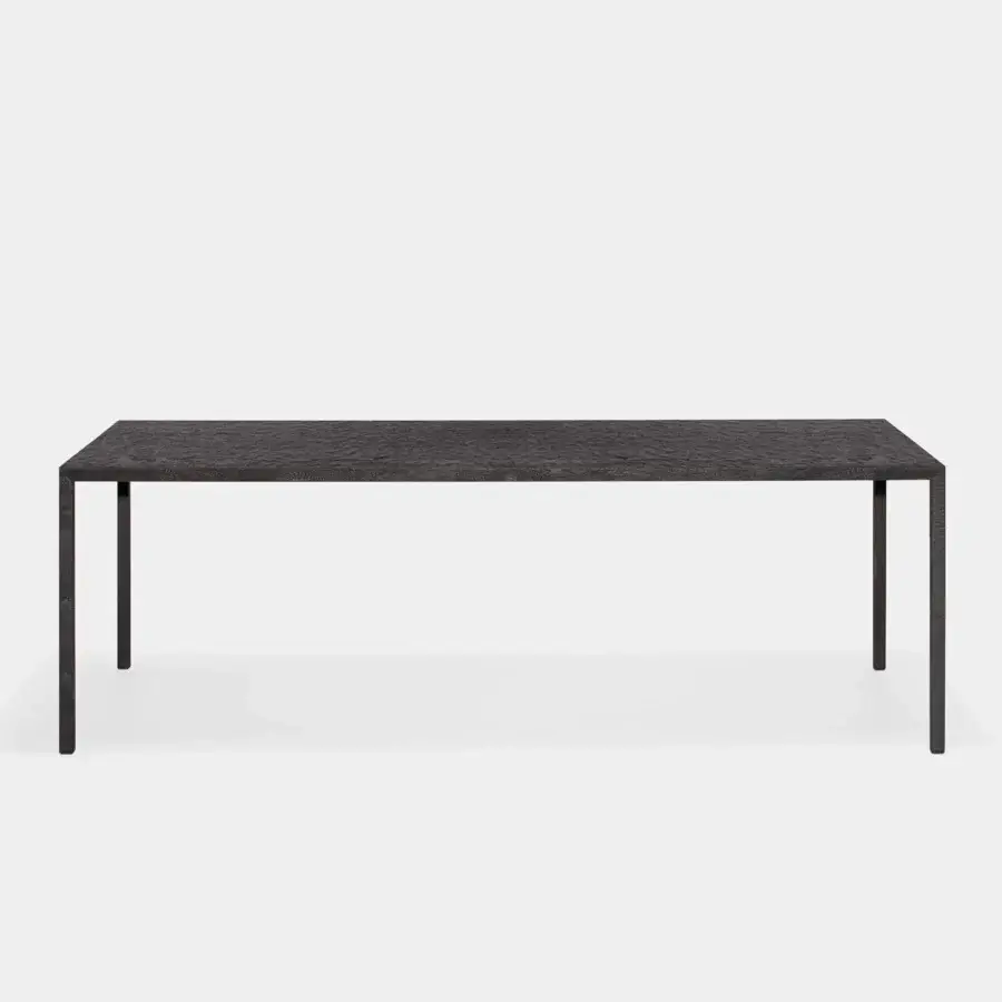 Superior MDF Italia Tense Material Heritage table in black-stained or natural oak with a sculpted ‘sgorbiatura’ finish and slender steel legs