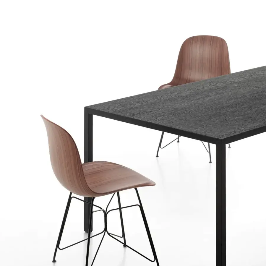 Superior MDF Italia Tense Material Heritage table crafted in dark oak with textured finish and sleek black powder-coated steel legs