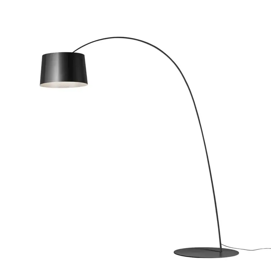Elegant Foscarini Twiggy floor lamp with a curved fiberglass composite structure and liquid-coated black finish