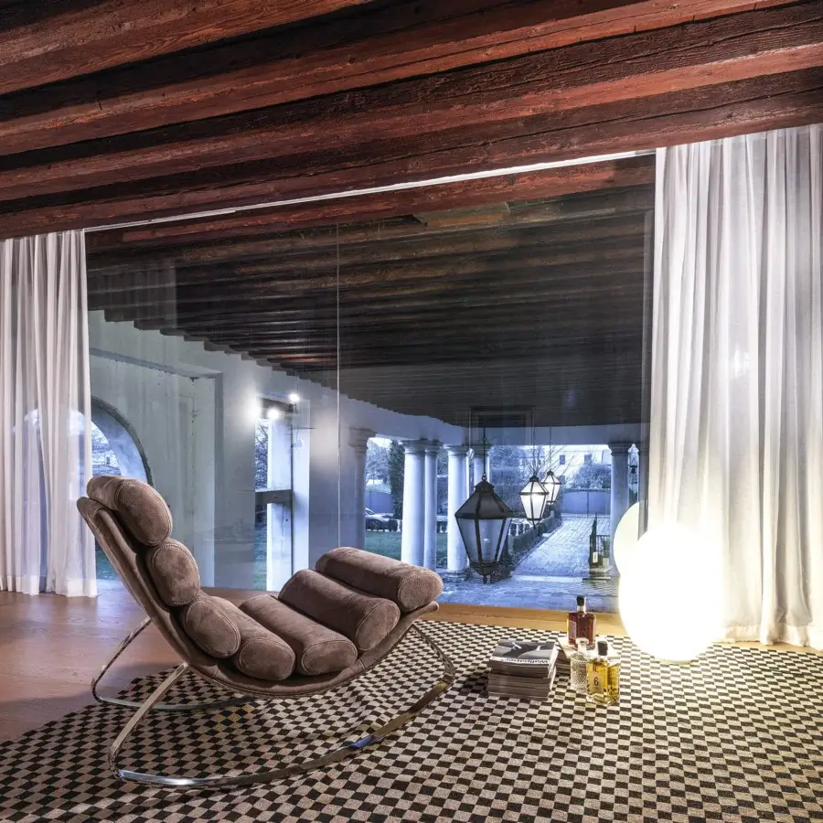 Distinguished Cierre1972 Monet rocking chair crafted with a metal structure and light brown textile cushions with a polished finish