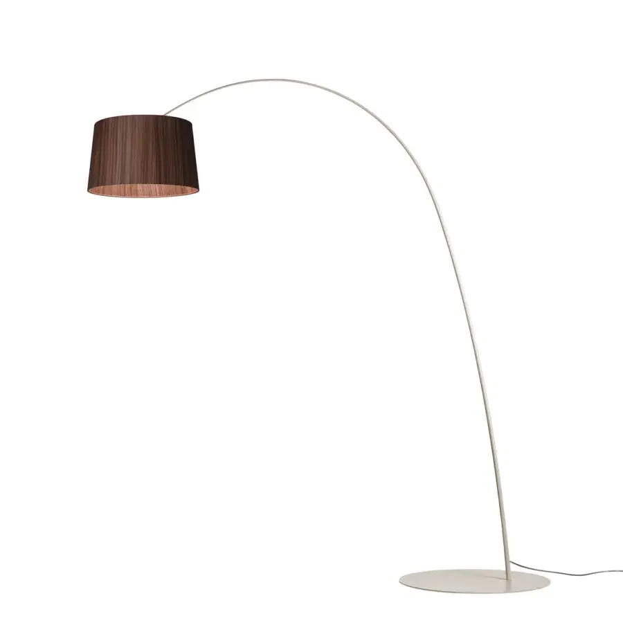 Distinguished Foscarini Twiggy Wood floor lamp with a curved silhouette crafted in limed maple oak and fiberglass composite with a matte finish