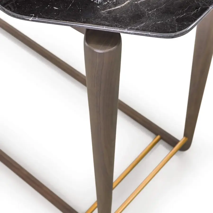 Lavish Turri Vine console with dark marble top and striking natural wood base crafted with brushed gold details