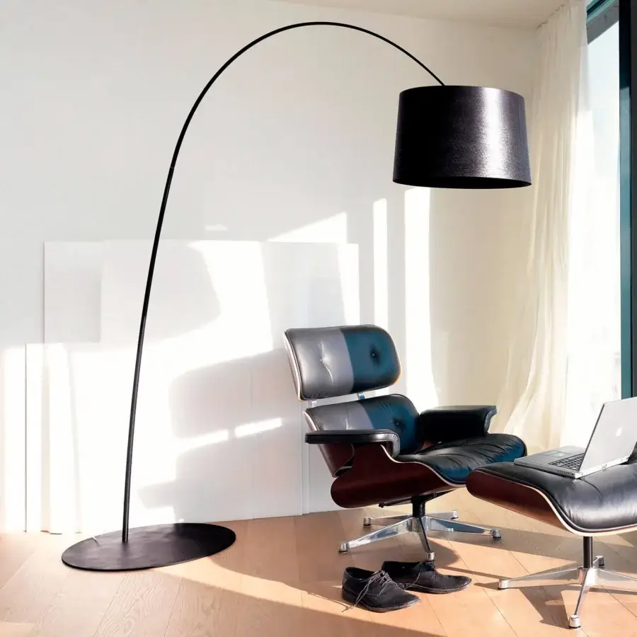 Captivating Foscarini Twiggy Elle floor lamp with a curved silhouette crafted in fiberglass composite and liquid coated diffuser with matte black finish