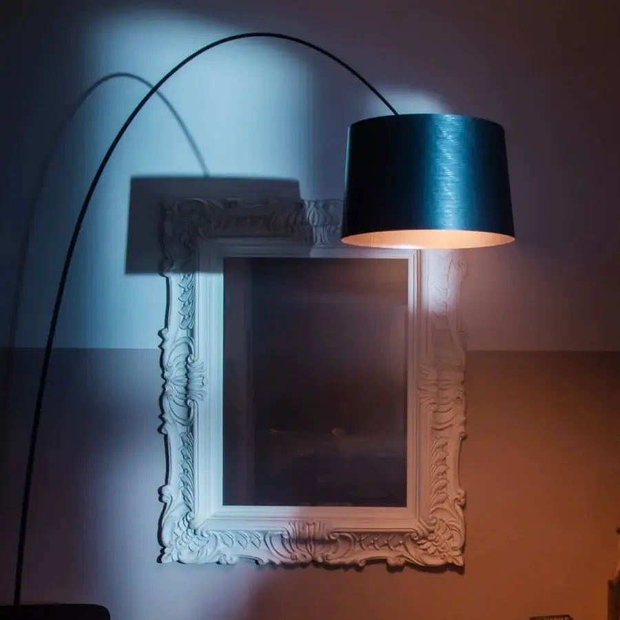 Elegant Foscarini Twiggy Elle floor lamp with a slender arching arm and liquid-coated fiberglass composite diffuser
