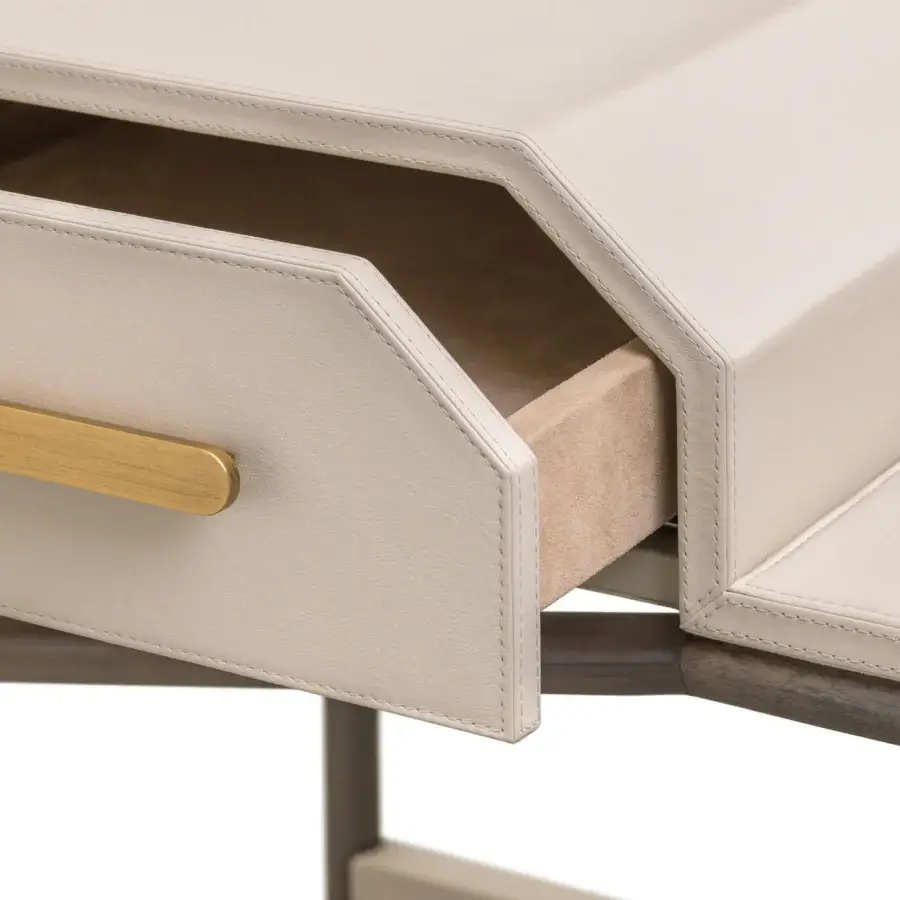 Lavish Turri Vine vanity with geometric lines, light beige leather covering and brushed gold metal details offering a uniform finish
