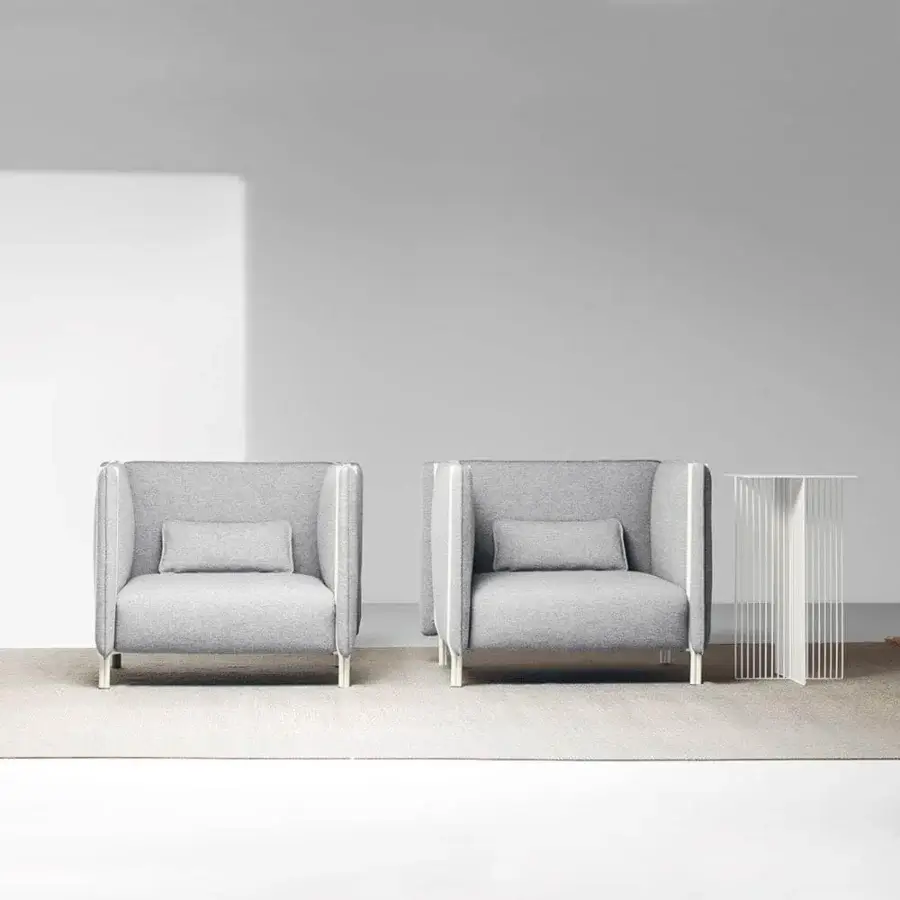 Elegant LaCividina Pinch lounge chair with light-colored metal framing and sophisticated grey textile upholstery with subtle trim outlining