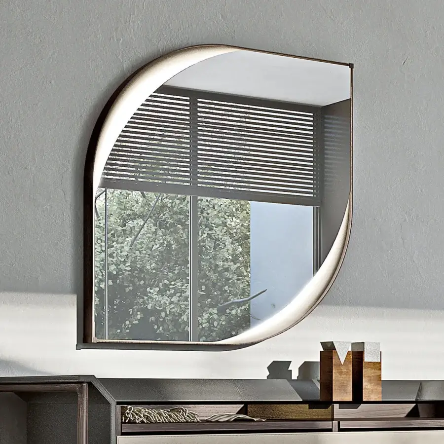 Elegant Turri Vine Teardrop mirror with brushed gold metal frame and soft leather applications illuminated by hidden internal lighting
