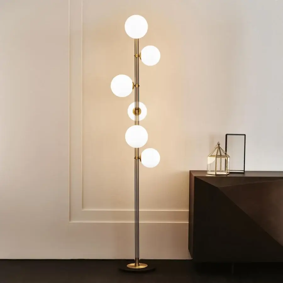 Exquisite Cattelan Italia Planeta floor lamp with burnished steel and brushed brass accents emitting warm satin white glass illumination