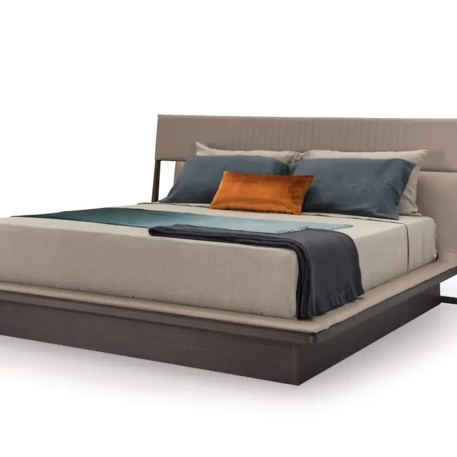 Superior Turri Vine bed with light beige textile and dark brown wood, showcasing impeccable stitching and colorful pillows