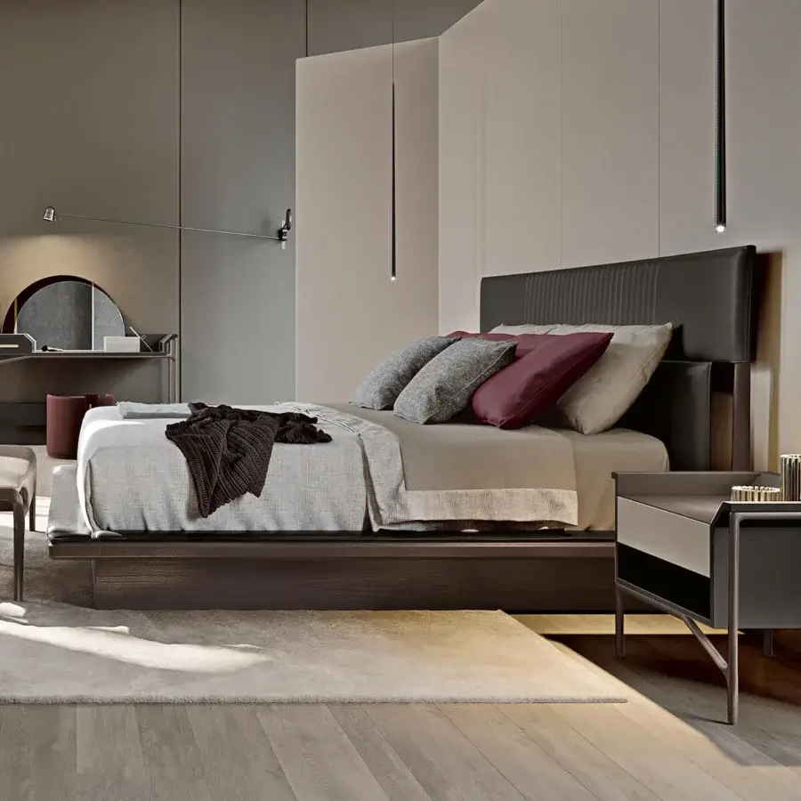 Exceptional Turri Vine bed with leather upholstery and natural wood, exhibiting a dark matte finish and muted chromatic contrast