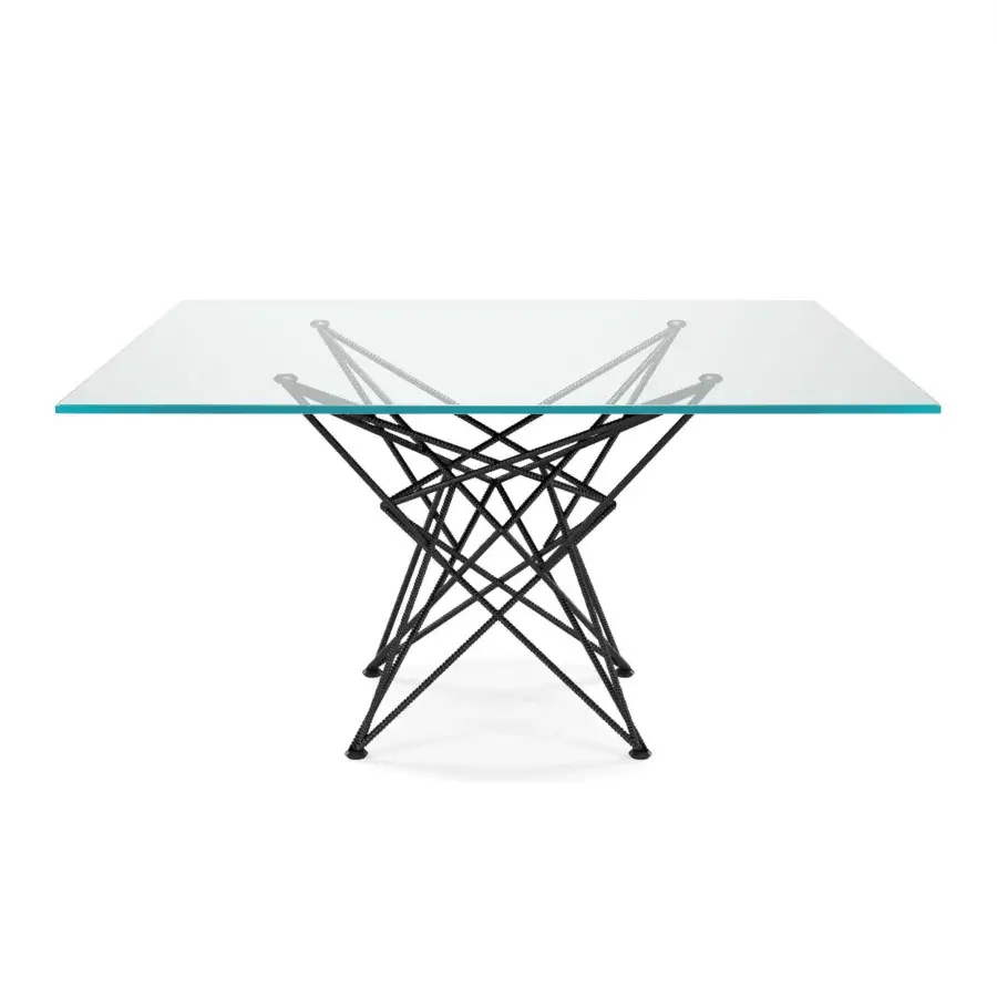 Elegant Cattelan Italia Gordon table with crystal top and geometrically complex dark metal base exhibiting a textured finish