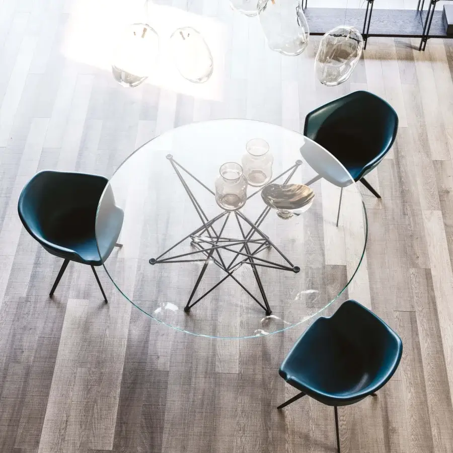 Superior Cattelan Italia Gordon table with round crystal top and star-like dark geometric metal base