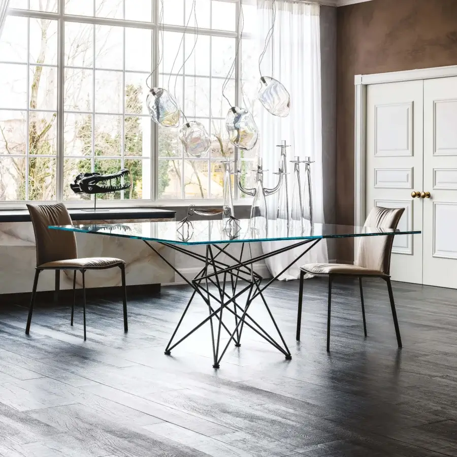 Captivating Cattelan Italia Gordon table with clear crystal top and intersecting dark matte metal base