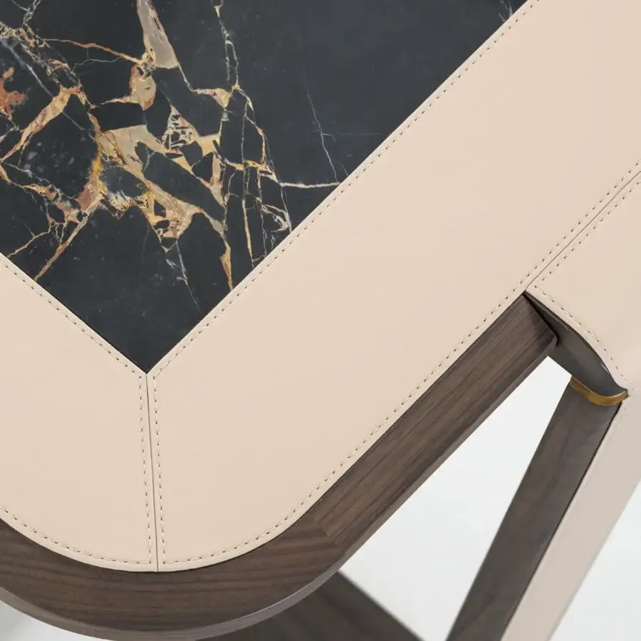 Exceptional Turri Vine side table with a square leather top inset in glossy, black marble-like material and gilded wooden base with satin finish