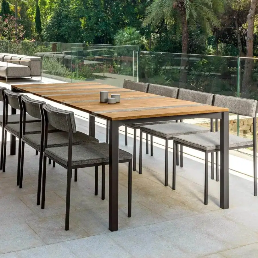 Distinguished Talenti Casilda chair with a geometric stainless steel structure and gray textile seat, crafted with a powder coated finish