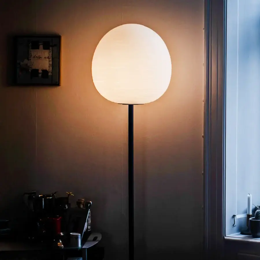 Distinguished Foscarini Rituals floor lamp with blown glass diffuser and dark metal rod, exhibiting a plaster-like striped finish