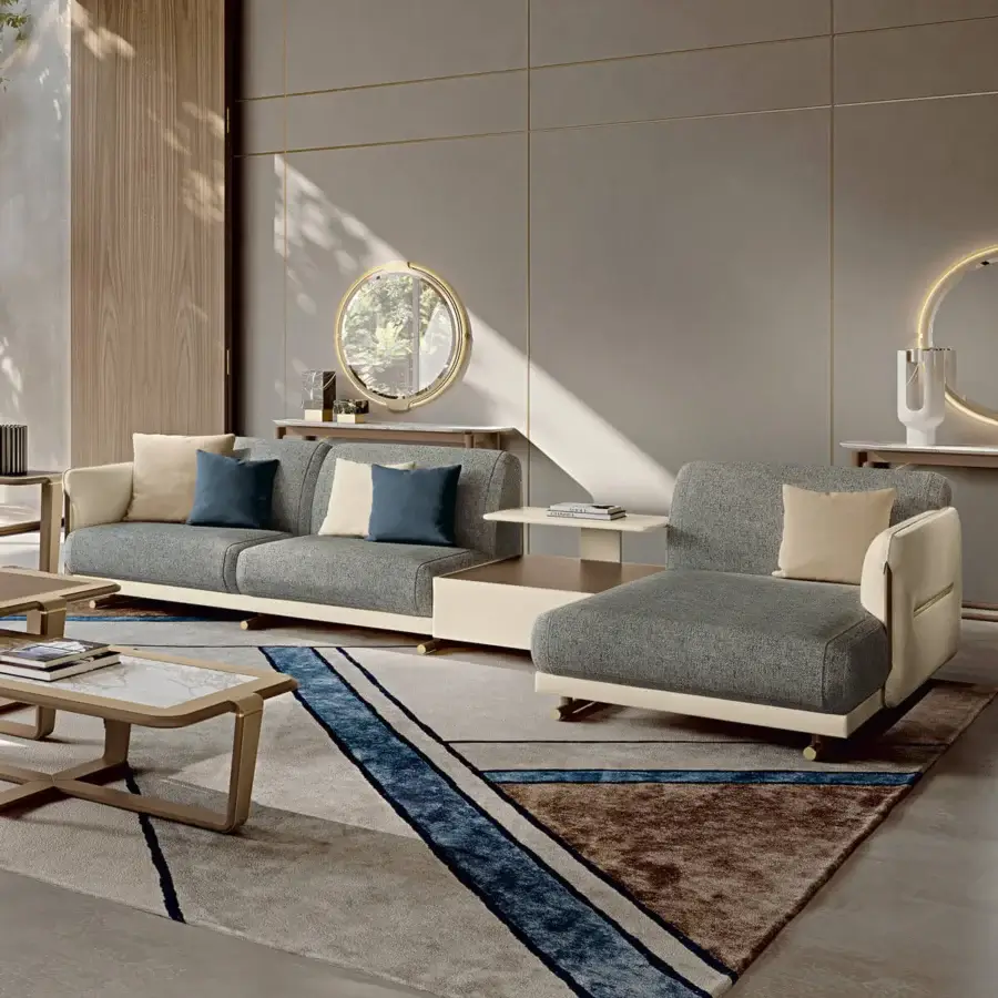 Sophisticated Turri Vine sectional with external leather shell and textured gray fabric cushions, built with brushed gold metal accents