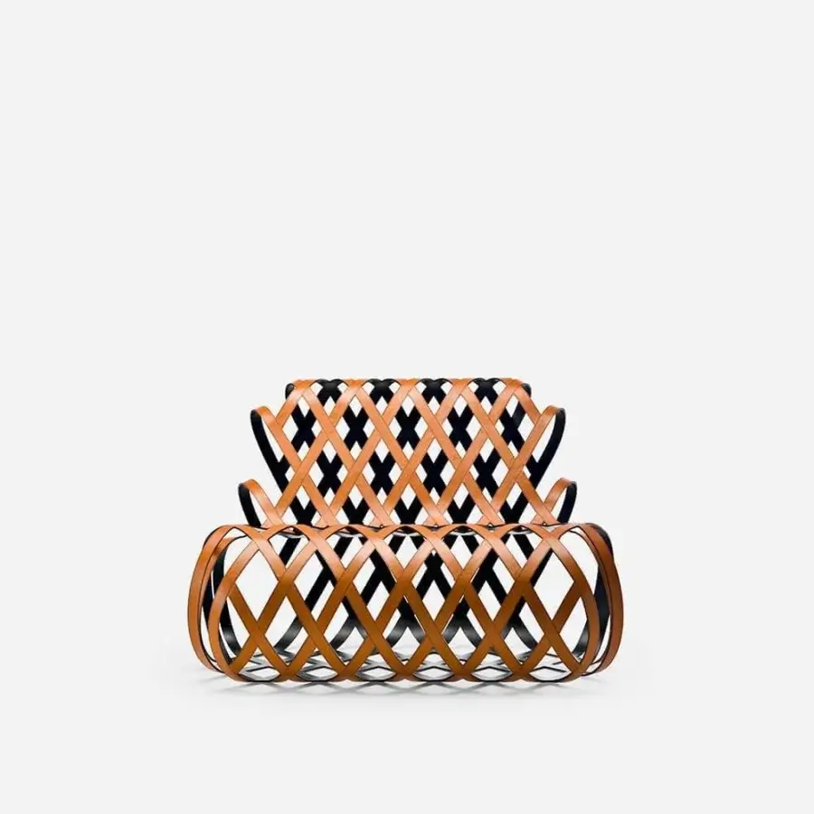 Exceptional LaCividina Aria lounge chair with a steel frame and hand-applied tan saddle leather woven into a geometric lattice finish