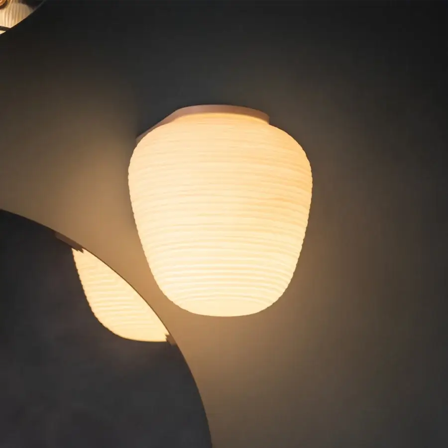 Elegant Foscarini Rituals Semi wall lamp with hand-blown glass and plaster-like finish emitting warm diffused light