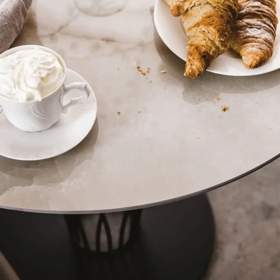Distinguished Cattelan Italia Nido Keramik bistrot table with light grey and beige Marmi ceramic and dark lacquered steel base crafted in Italy
