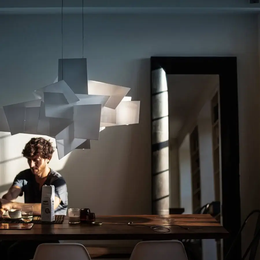 Avant-garde Foscarini Big Bang suspension lamp with a chaotic geometric silhouette crafted in white aluminum and translucent methacrylate slabs