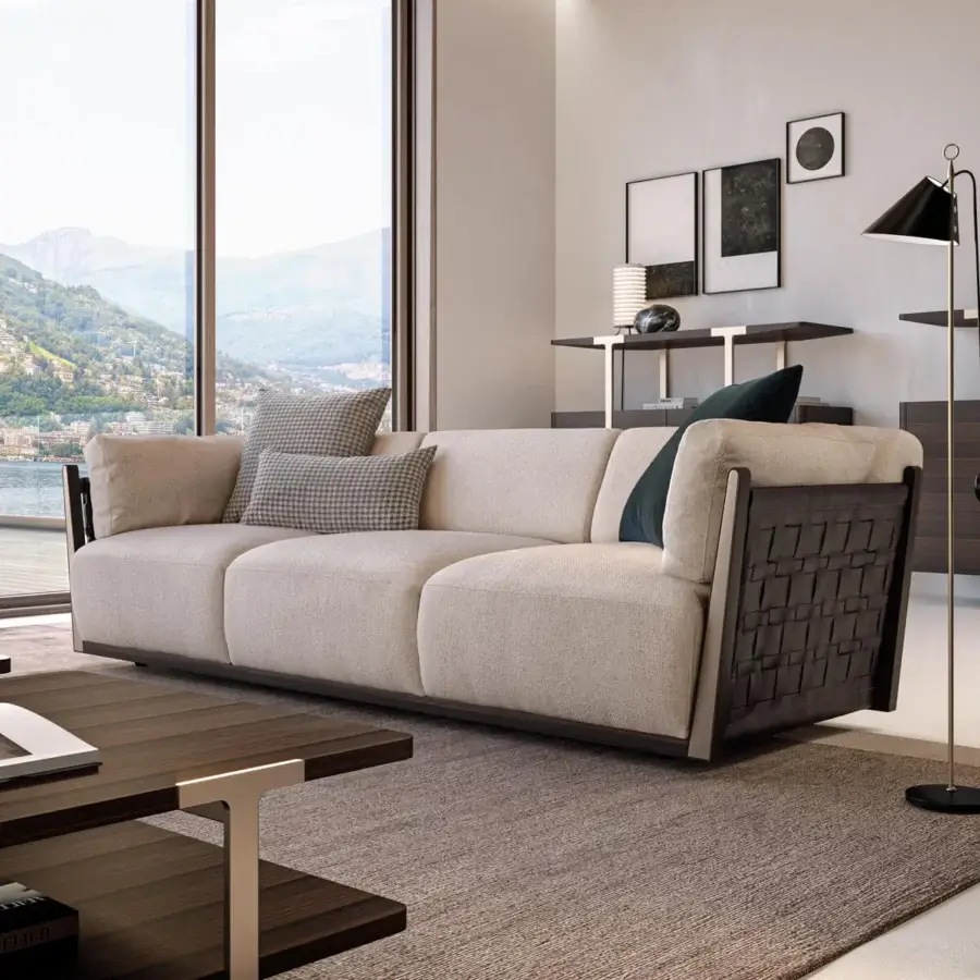 Exceptional Turri Net sofa with Eucalyptus wood frame, woven leather detailing and light beige textile upholstery complemented by checkered pillows