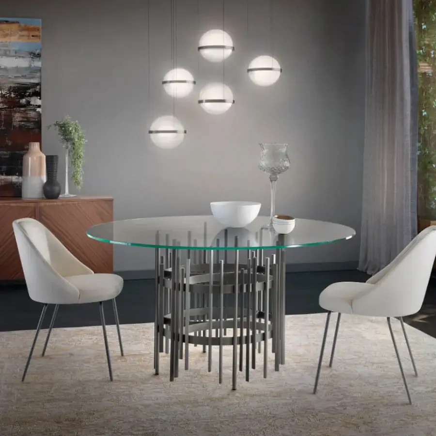Exclusive Pacini & Cappellini Amy chair upholstered in light cream textile with smooth curved form and dark painted metal legs