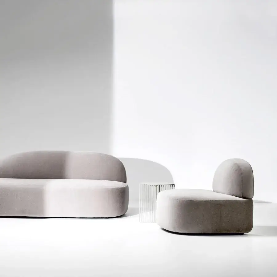 Elegant LaCividina Guest lounge chair with cylindrical seat and curved backrest upholstered in muted gray textile