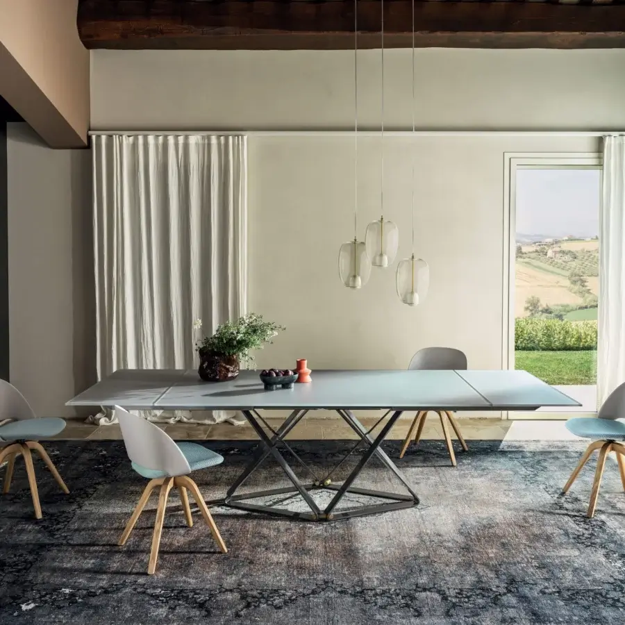 Distinguished Bontempi Delta table with light gray tabletop and dark metal geometric base exhibiting a smooth matte finish