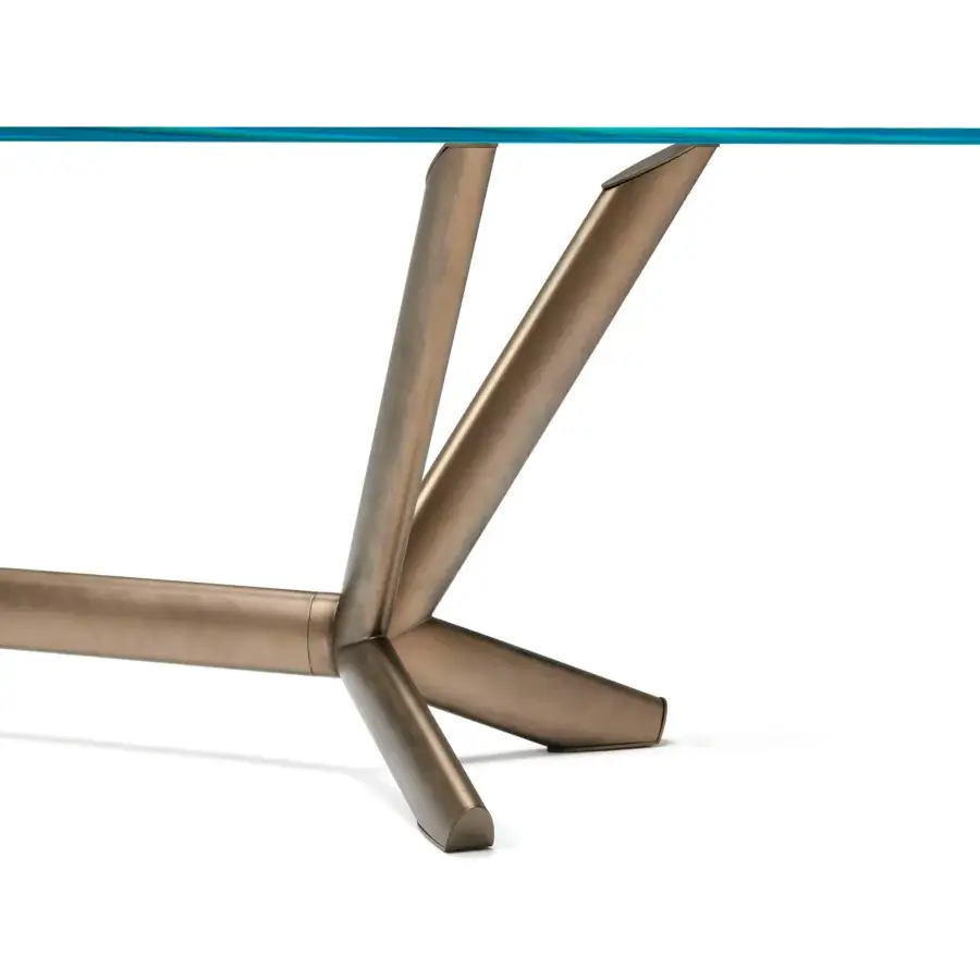 Captivating Cattelan Italia Planer table with a glass top and sculptural bronze-like painted steel base crafted with angular lines