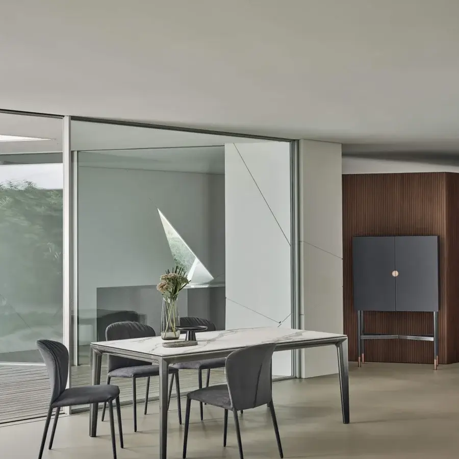 Elegant Bontempi Duke table with stone-like tabletop and dark matte metal frame for contemporary living spaces