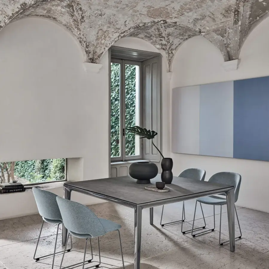 Superior Bontempi Duke Square table with stone-like surfaces and polished metal frame in a medium gray matte finish