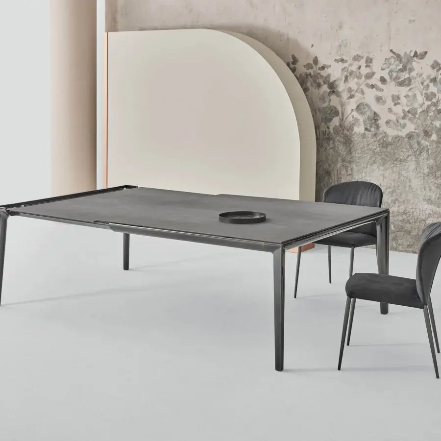 Elegant Bontempi Duke Square table with dark gray stone-like tabletop and polished dark metal frame and legs