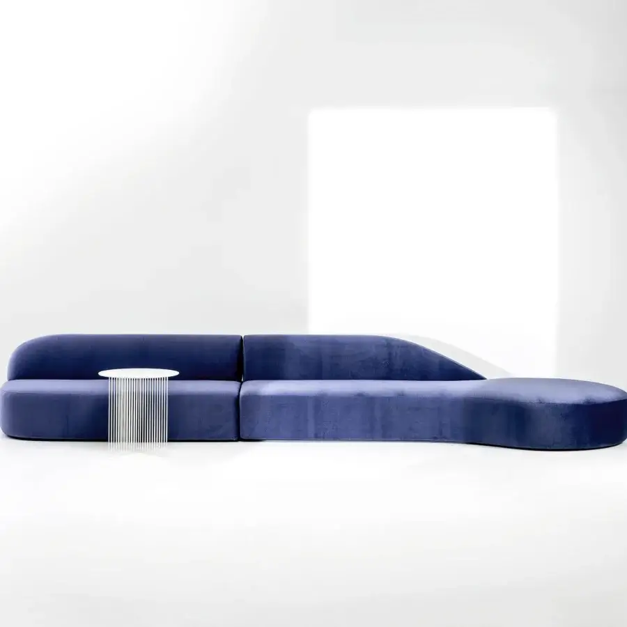 Lavish LaCividina Guest sectional with countless landscapes upholstered in deep blue plush fabric and a curved silhouette