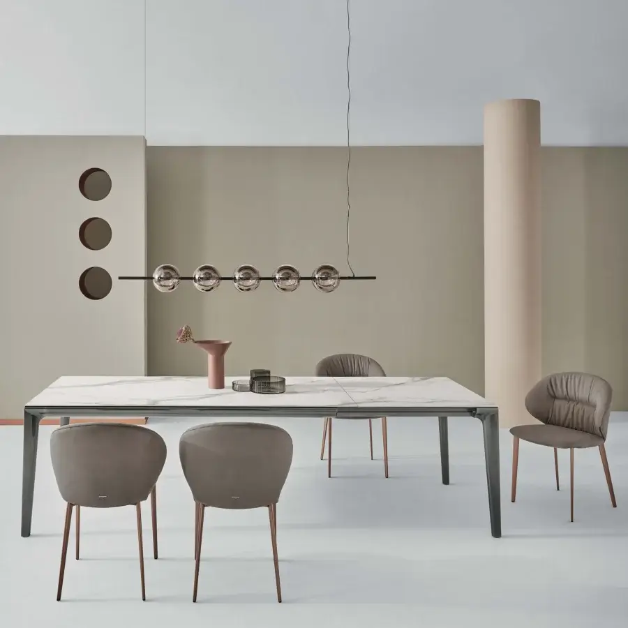 Superior Bontempi Duke rectangular extendable table with white marble-pattern tabletop and dark gray metal frame built with copper-toned legs