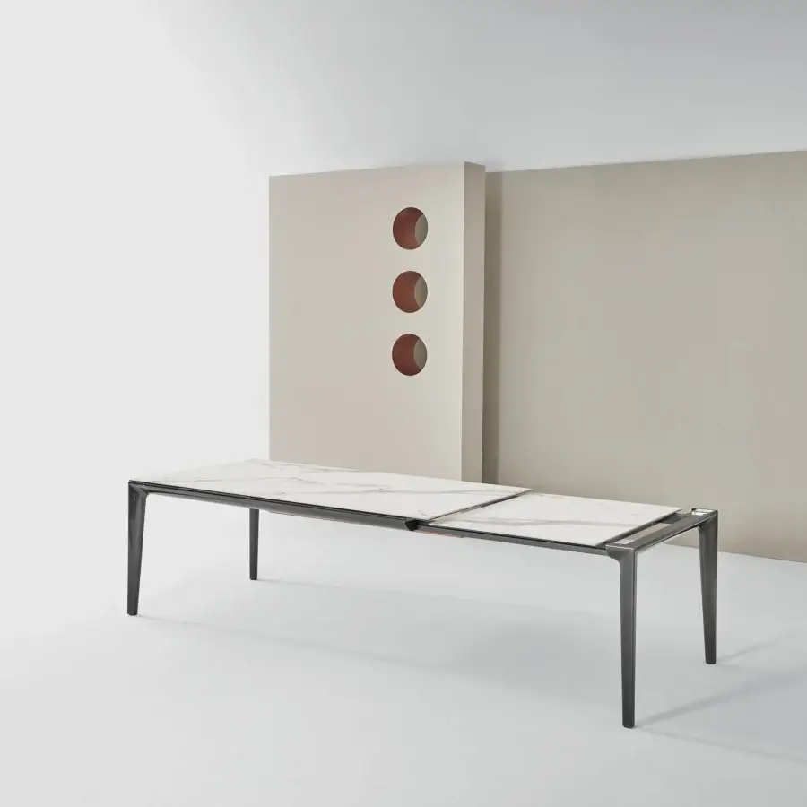 Elegant Bontempi Duke table with light gray marble-like top and sleek dark-toned metal frame and legs