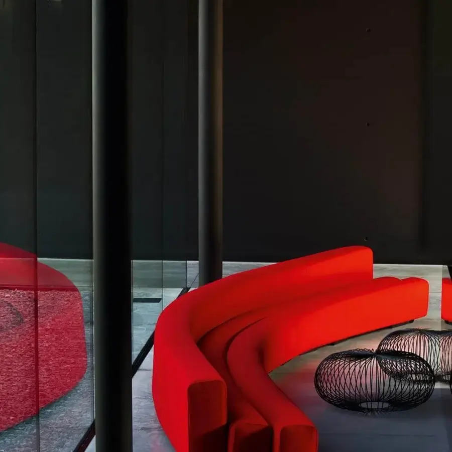 Exceptional LaCividina Osaka sofa with curvy organic lines upholstered in bright red stretch fabric and steel structure