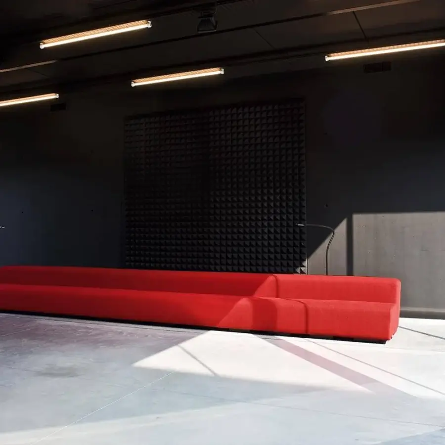 Distinguished LaCividina Osaka sofa with compact form upholstered in vibrant red stretch fabric and non-deforming expanded polyurethane padding