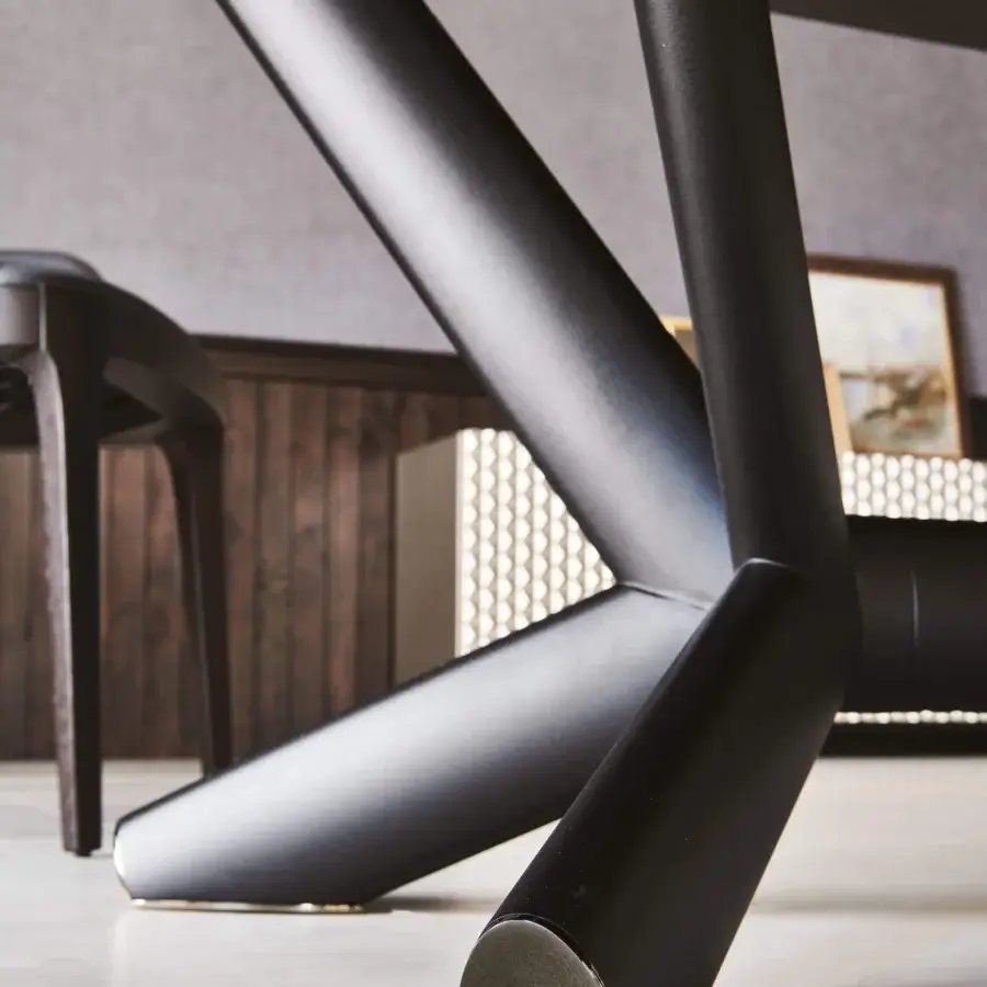 Distinguished Cattelan Italia Planer table with ceramic top and matte steel base displaying angular legs crafted with cylindrical metal tubes